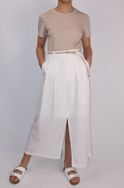 Person wearing a white skirt with top