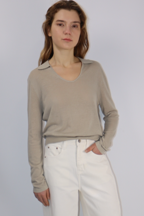 Model wearing beige U-neck knit top with collar detail, long sleeves, and true-to-size fit.